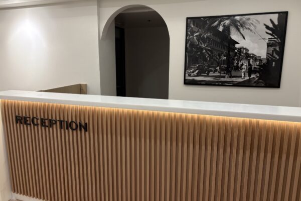 3rd Floor Reception- desk that says reception with a photo behind