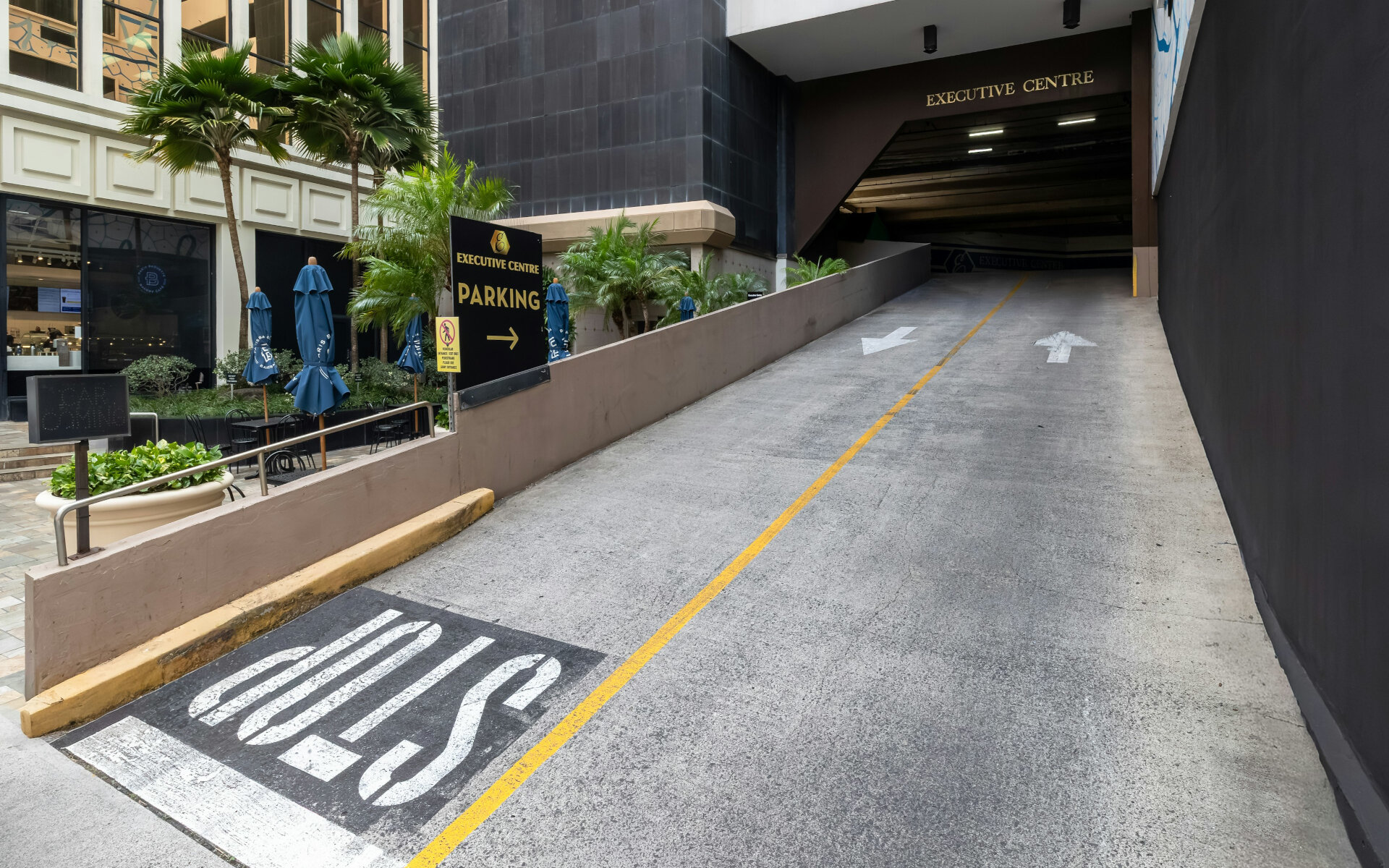 Ground view of the entrance to Bishop Suites parking