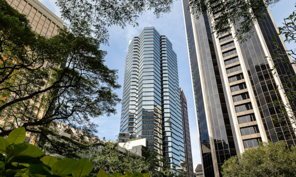 Exterior image of Bishop Suites next to other buildings in Downtown Honolulu